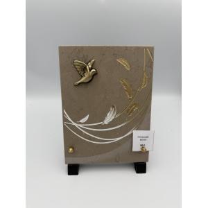 Plaque funéraire en céramique beige avec colombe en bronze